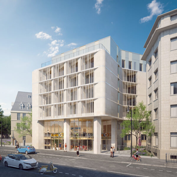 Vue de l'entrée principale de l'Institut Curie conçu par l'agence d'architecture A26, mettant en avant l'architecture contemporaine et l'efficacité énergétique hospitalière, avec des espaces extérieurs accessibles et intégrant des solutions pour les personnes à mobilité réduite.