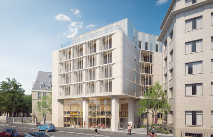 Vue de l'entrée principale de l'Institut Curie conçu par l'agence d'architecture A26, mettant en avant l'architecture contemporaine et l'efficacité énergétique hospitalière, avec des espaces extérieurs accessibles et intégrant des solutions pour les personnes à mobilité réduite.